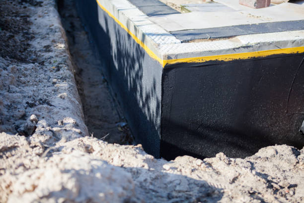 Professional Interior Drainage System technician working in Versailles, IN